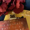 peeking-cat-bookmark-in-book.webp